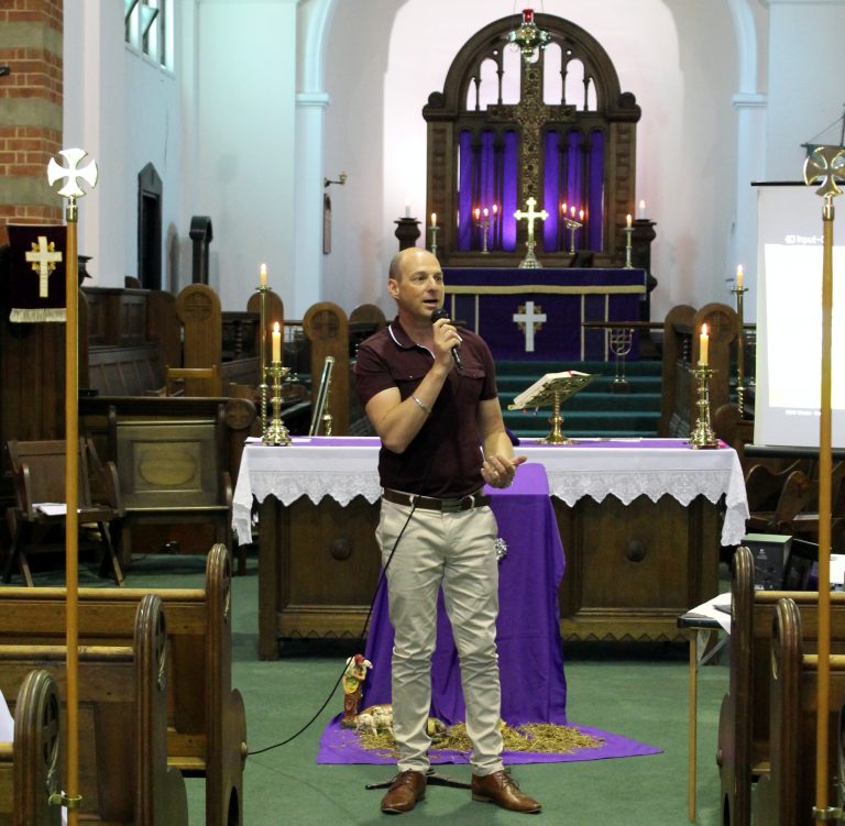 Nigel Cooper of Compassion Australia addresses the congregation