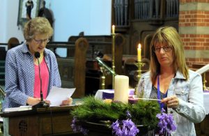 Cherie Cooper lights the Advent Candles of Hope and Love, while Fiona Hemstock reads Advent prayers