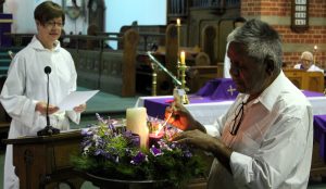 Edmund Wanganeen lights the Advent Candles at the 9.30am service as Sara Blunt, Lay Assistant, reads prayers